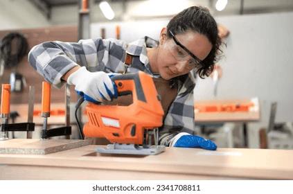 Close-up of various power tools such as a drill, circular saw, and angle grinder on a well-organized workbench, designed for home improvement and construction tasks. Close-up of various power tools such as a drill, circular saw, and angle grinder on a well-organized workbench, designed for home improvement and construction tasks.
