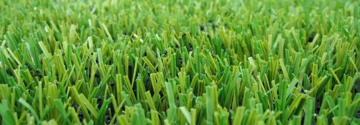 Close-up of artificial turf blade structure showing dense synthetic grass fibers engineered for durability, performance, and landscaping use