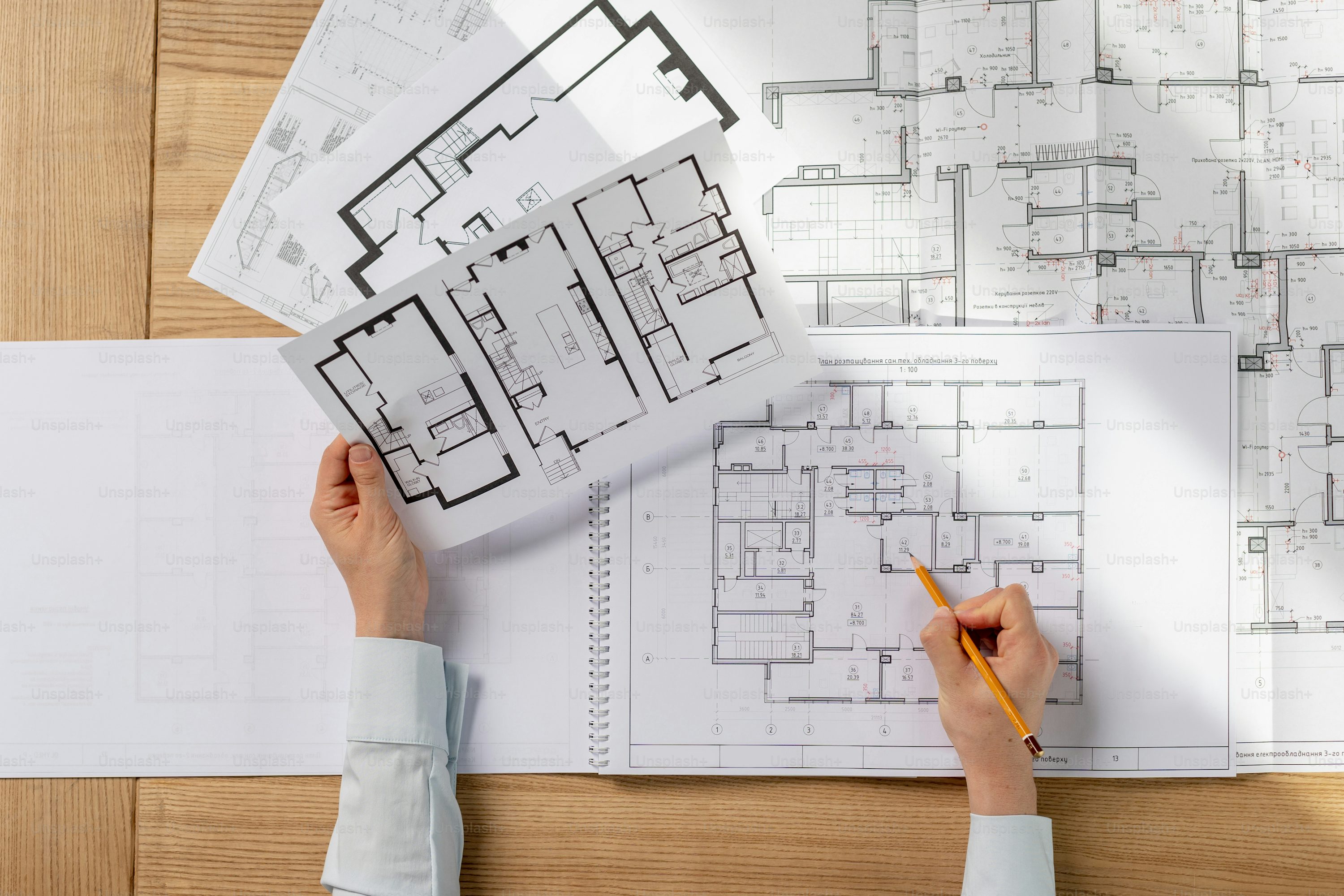 Architect reviewing house plan drawings – Homizon architectural planning services