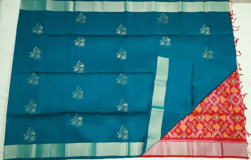Teal green silk saree with silver buttas with pochampally pink pallu
