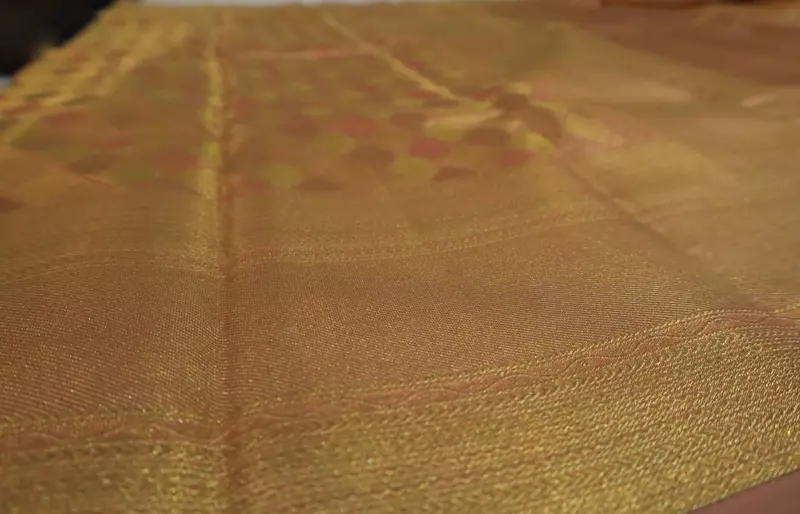 Peach orange Kanjivaram silk saree with zari border