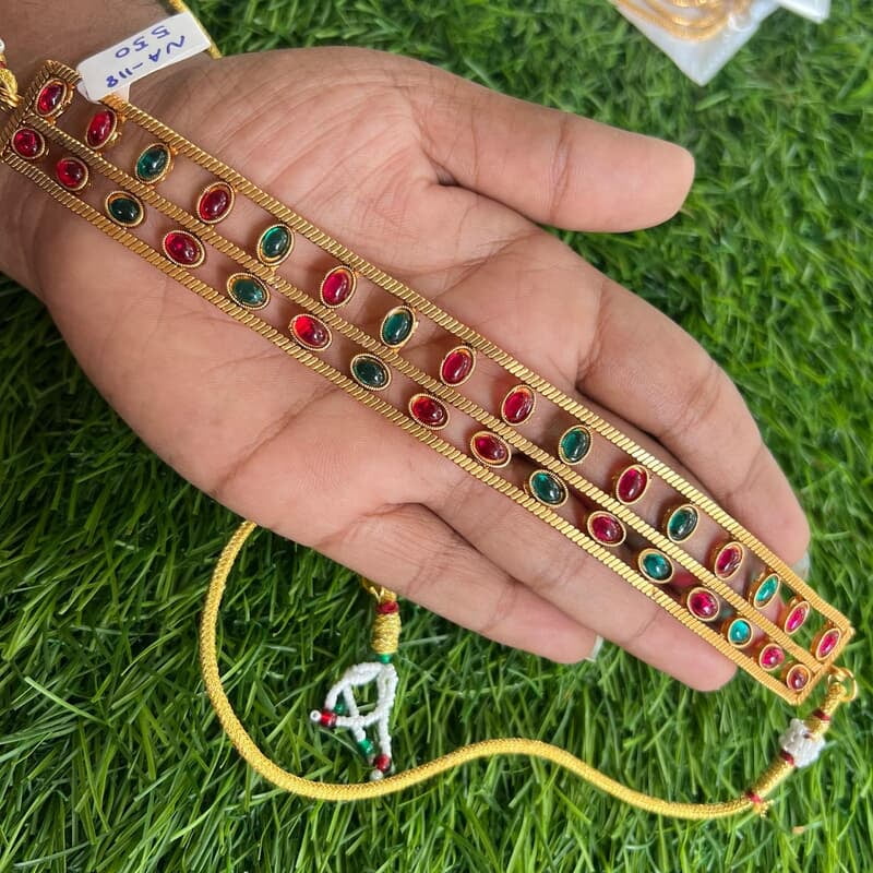 Double line within oval shape design with stone neckpiece