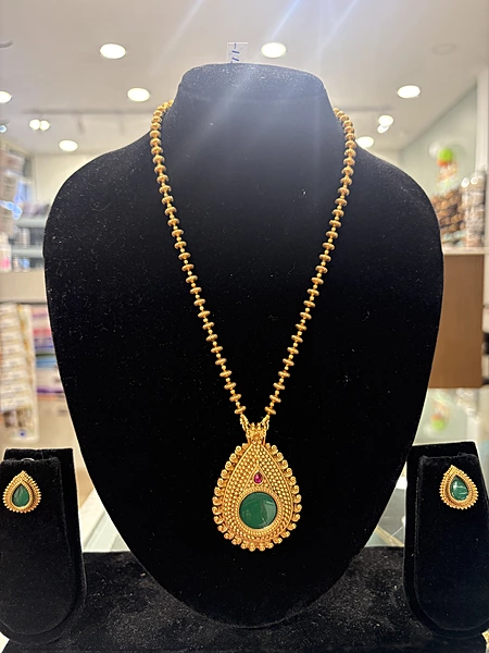 Golden haaram with green pendant