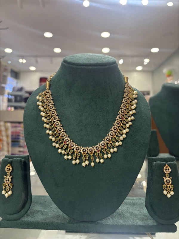Golden AD Necklace Set with Ruby & Emerald stones and white beads