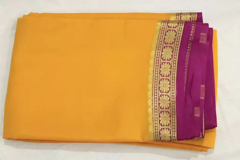 Yellow mysore silk saree with rich gold zari border and Magenta pallu.