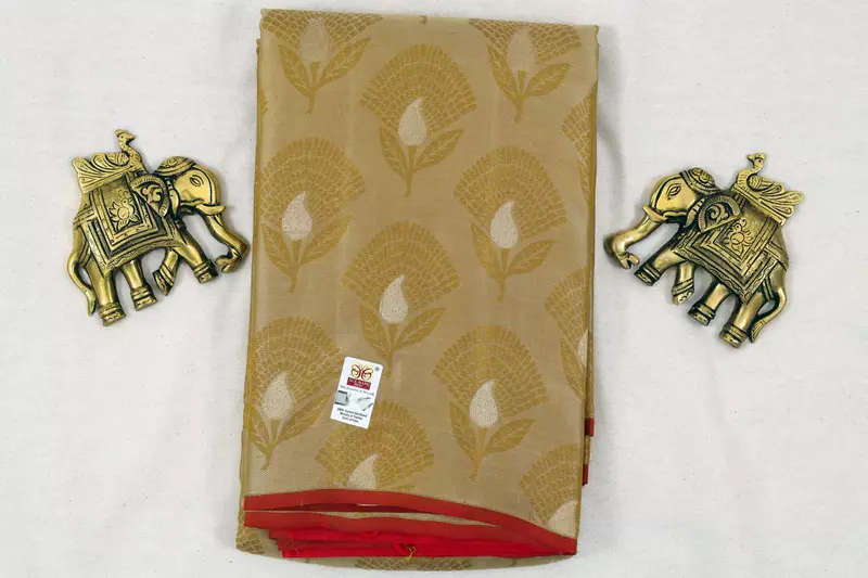Golden beige silk saree with red zari border