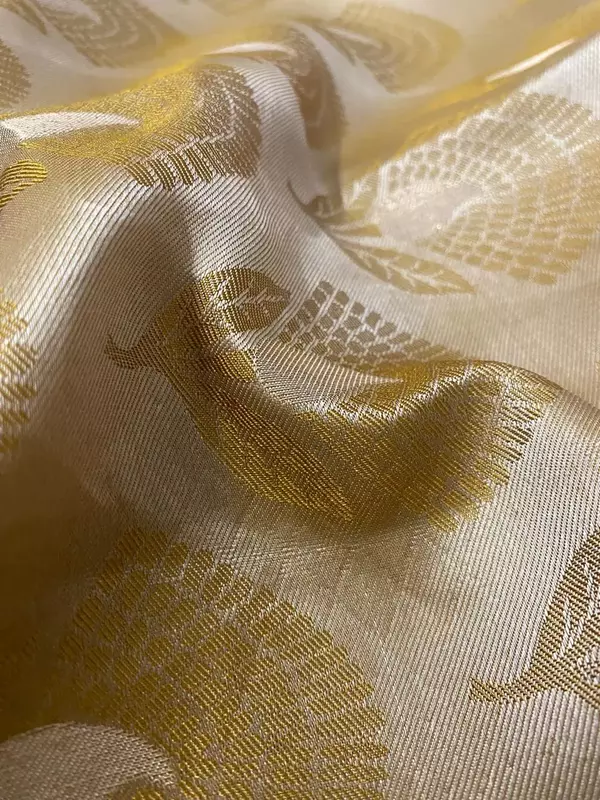 Golden beige silk saree with red zari border