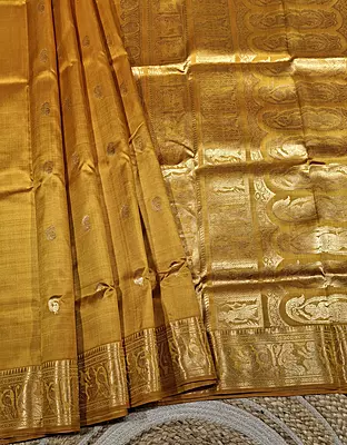 Golden mustard color resham peacock motif Swarnachari saree