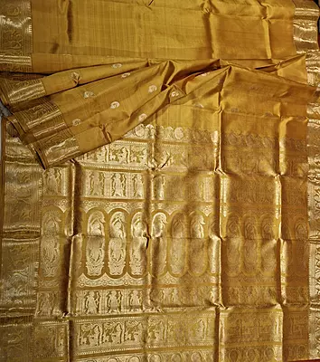 Golden mustard color resham peacock motif Swarnachari saree