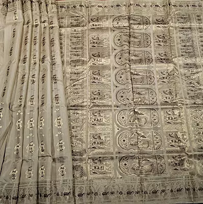 Figure motif Swarnachari in pure tassar with golden zari and dark maroon meena