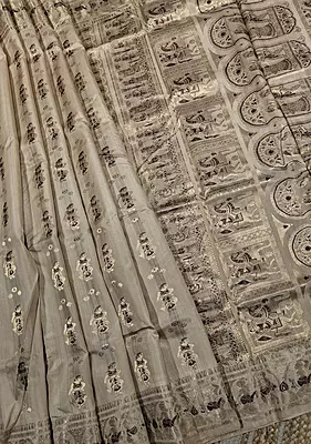 Figure motif Swarnachari in pure tassar with golden zari and dark maroon meena