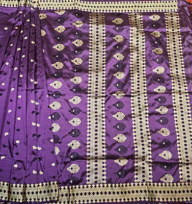 Assam Paat Silk Saree in dark Aubergine with Black and Mustard Woven Motifs Assam Paat Silk Saree in dark Aubergine with Black and Mustard Woven Motifs