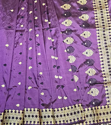 Assam Paat Silk Saree in dark Aubergine with Black and Mustard Woven Motifs Assam Paat Silk Saree in dark Aubergine with Black and Mustard Woven Motifs