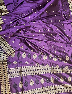 Assam Paat Silk Saree in dark Aubergine with Black and Mustard Woven Motifs Assam Paat Silk Saree in dark Aubergine with Black and Mustard Woven Motifs