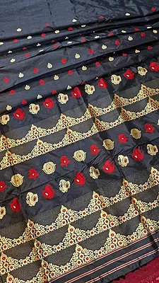 Assam Paat Silk Saree in Jet black with Woven red and dark beige Motifs Assam Paat Silk Saree in Jet black with Woven red and dark beige Motifs