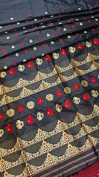 Assam Paat Silk Saree in Jet black with Woven red and dark beige Motifs Assam Paat Silk Saree in Jet black with Woven red and dark beige Motifs