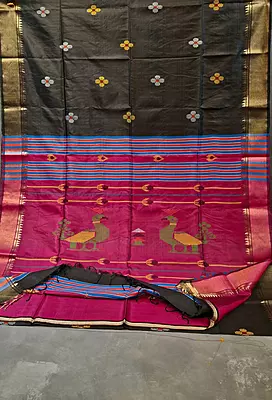 Colour jet black body, golden zari Kalashetra saree with contrast rani pink pallu Colour jet black body, golden zari Kalashetra saree with contrast rani pink pallu