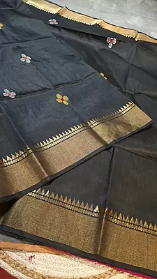 Colour jet black body, golden zari Kalashetra saree with contrast rani pink pallu
