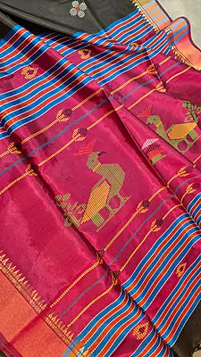 Colour jet black body, golden zari Kalashetra saree with contrast rani pink pallu
