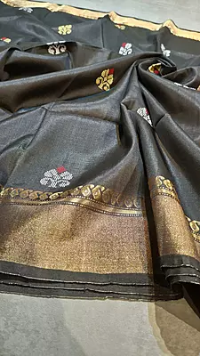 Jet black body with golden zari and contrast rust orange pallu Kalashetra saree