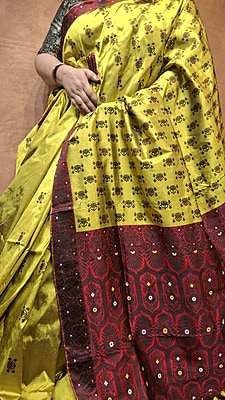 Assam Paat Silk Saree – Greenish Mustard with Contrast Red & Black Border Assam Paat Silk Saree – Greenish Mustard with Contrast Red & Black Border