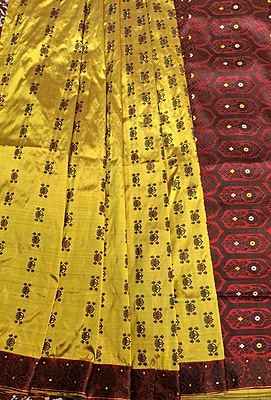 Assam Paat Silk Saree – Greenish Mustard with Contrast Red & Black Border Assam Paat Silk Saree – Greenish Mustard with Contrast Red & Black Border