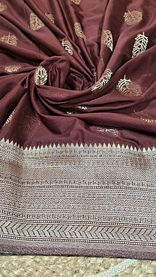 Elegant Maroon Khaddi Saree with Intricate Metallic Leaf Motifs & Rich Woven Border Elegant Maroon Khaddi Saree with Intricate Metallic Leaf Motifs & Rich Woven Border