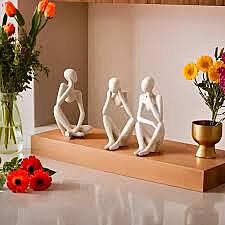 3 sitting statues