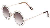 Soigné Female Medium Round Sunglasses. Transparent&Brown Lens Soigné Female Medium Round Sunglasses. Transparent&Brown Lens