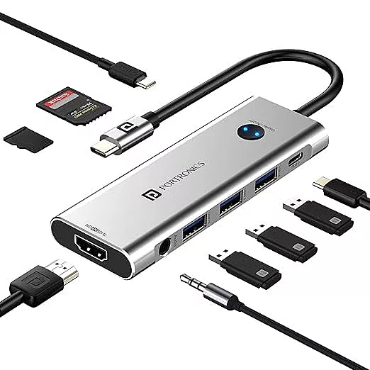 Portronics Mport One – 9-in-1 USB-C Hub features 4K HDMI, USB 3.0 ports, SD card reader, and more. Perfect for expanding connectivity for laptops and devices. Compact and portable design.