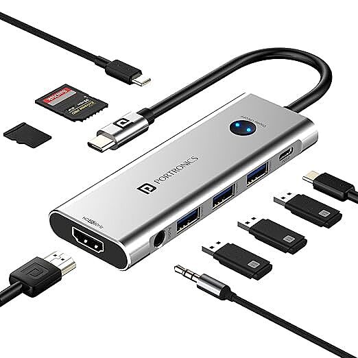 Portronics Mport One – 9-in-1 USB-C Hub features 4K HDMI, USB 3.0 ports, SD card reader, and more. Perfect for expanding connectivity for laptops and devices. Compact and portable design.