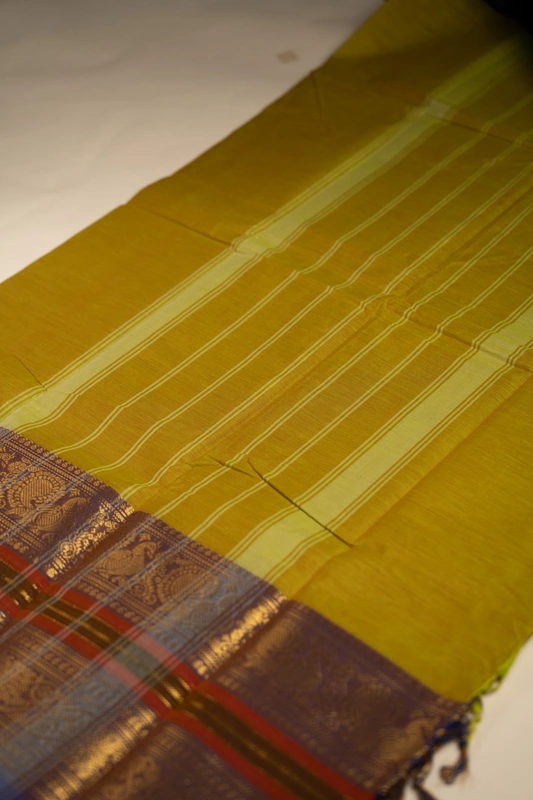 Kanchi Cotton plain body - Pista Green with Broad and Narrow Violet border