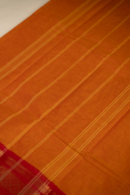 Kanchi Cotton plain body - Orange with Broad Red border
