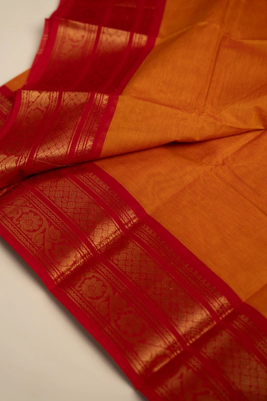 Kanchi Cotton plain body - Orange with Broad Red border