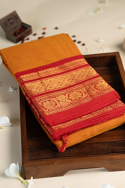 Kanchi Cotton plain body - Orange with Broad Red border