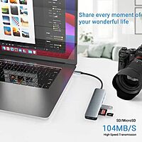 HAMMOK SPARKLE 7-in-1 Type-C Hub! This versatile hub features multiple ports for seamless connectivity, including HDMI, USB-A, and SD card slots, all in a sleek, compact design.