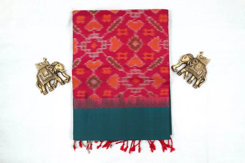 Teal green silk saree with silver buttas with pochampally pink pallu