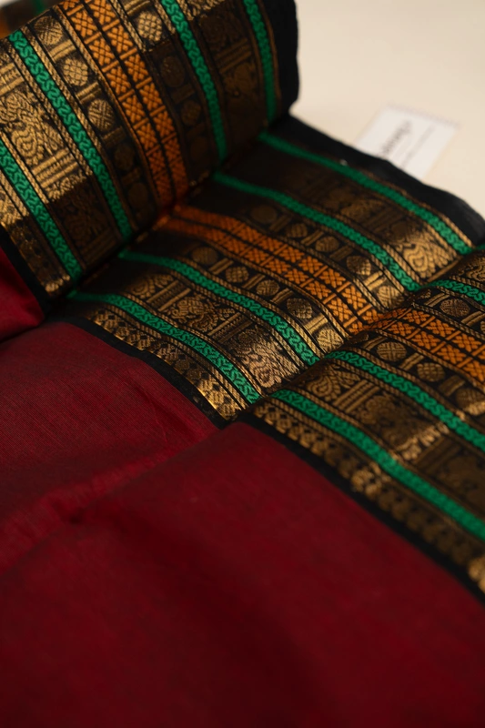 Kanchi Cotton plain body - Maroon Saree with Black Heritage Border and Antique Gold Zari