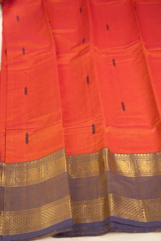 Kanchi Cotton body butta - Coral Orange Cotton Saree with Parrot Green Antique Gold Zari Bord