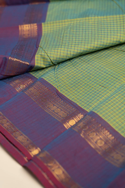 Kanchi Cotton body checks - Olive Green Checked Cotton Saree with Plum Purple Contrast Border