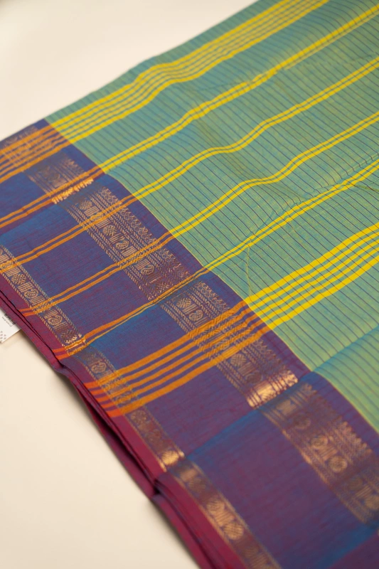 Kanchi Cotton body checks - Olive Green Checked Cotton Saree with Plum Purple Contrast Border