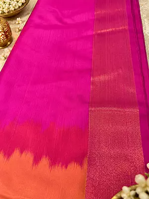 A beautiful blend of vibrant orange and rich magenta, adorned with exquisite golden zari motifs and an elegant traditional border