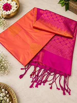 A beautiful blend of vibrant orange and rich magenta, adorned with exquisite golden zari motifs and an elegant traditional border