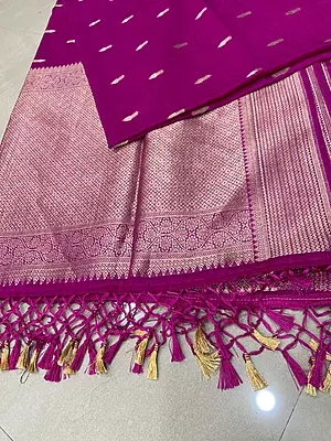 Fall in love with this gorgeous Mango Silk Saree, featuring a rich magenta shade with beautiful golden zari detailing