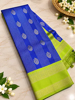A beautiful Parrot Green Semi Soft Silk Saree featuring an elegant all-over hexagonal geometric jacquard pattern that gives the fabric a rich, textured appearance.