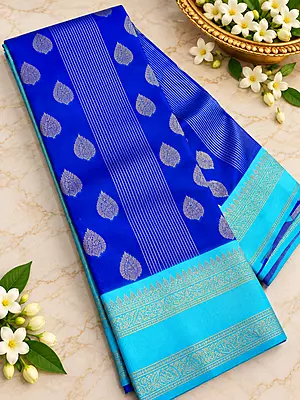 A gorgeous Turquoise Blue Semi Soft Silk Saree featuring an elegant all-over geometric jacquard weave that adds a subtle, luxurious texture to the fabric.