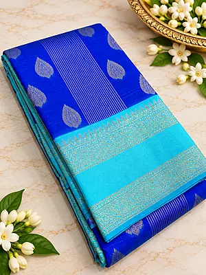 A gorgeous Turquoise Blue Semi Soft Silk Saree featuring an elegant all-over geometric jacquard weave that adds a subtle, luxurious texture to the fabric.