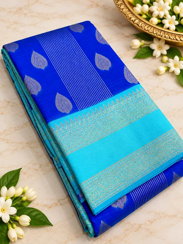 A gorgeous Turquoise Blue Semi Soft Silk Saree featuring an elegant all-over geometric jacquard weave that adds a subtle, luxurious texture to the fabric.