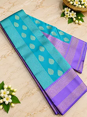 A graceful Lavender Purple Semi Soft Silk Saree featuring a delicate all-over geometric zari weave that creates a rich, textured look with a beautiful subtle sheen.