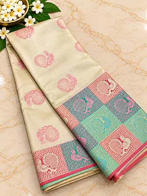 stunning ivory-gold Tissue Silk Saree featuring delicate pink paisley motifs beautifully scattered across the body.